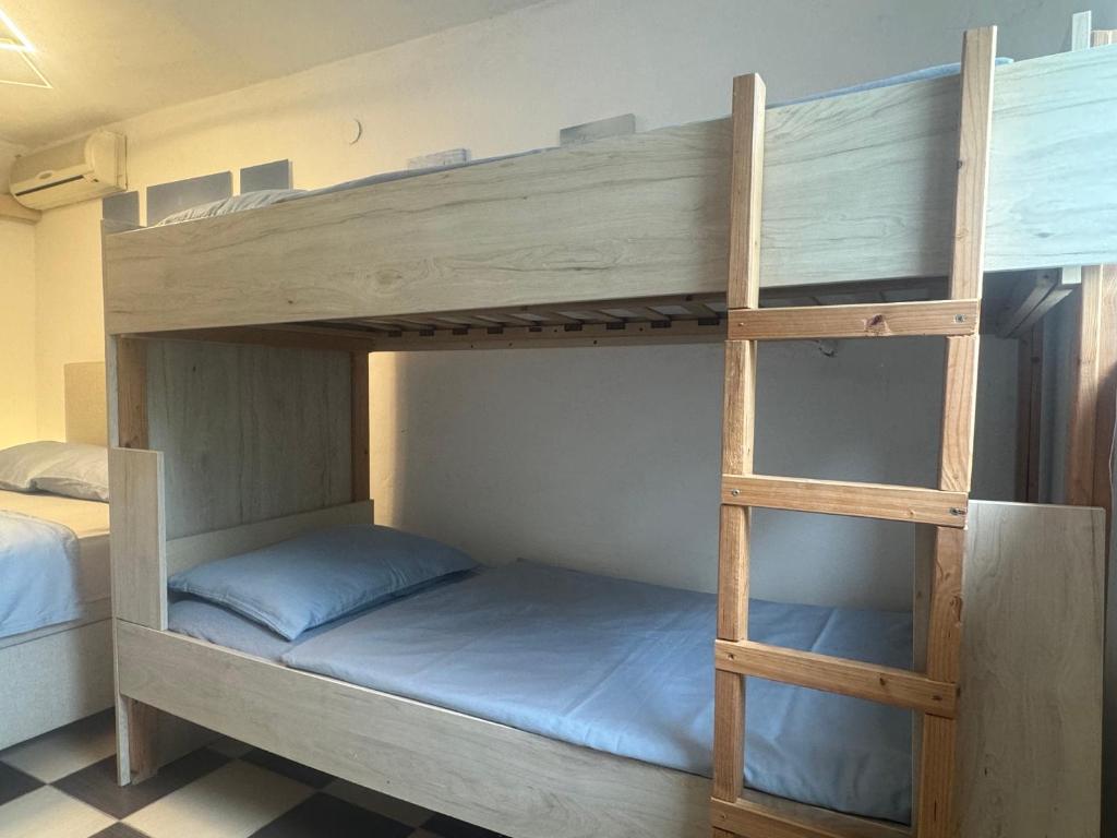 Postel nebo postele na pokoji v ubytování Zupan apartments