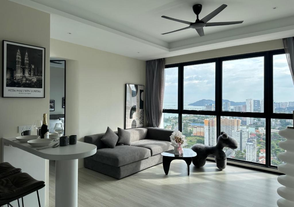 a living room with a couch and a table at DD Condominium 2Bedroom Sea view Georgetown Penang in Jelutong