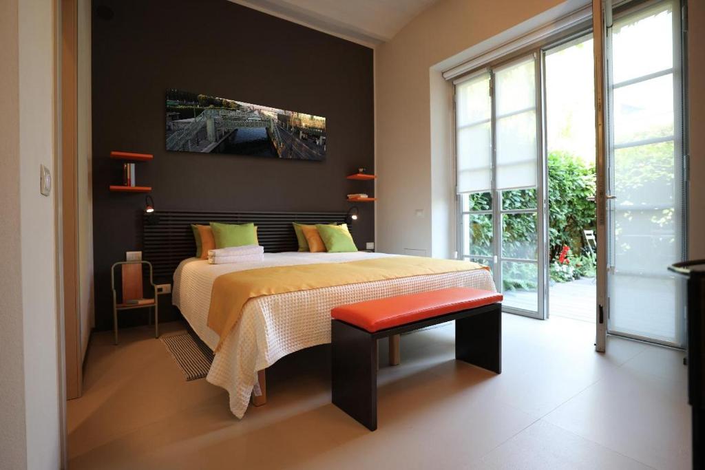 Postel nebo postele na pokoji v ubytování B&B Morindino Design