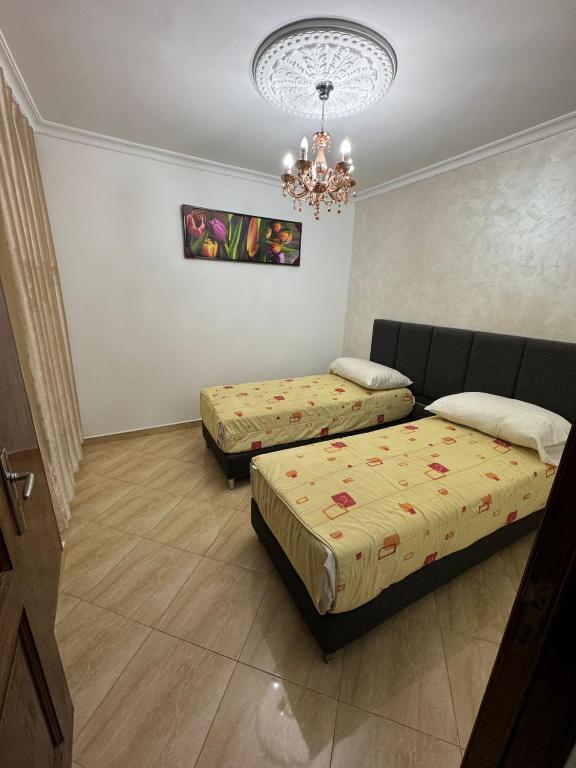 Postel nebo postele na pokoji v ubytování Appart Hotel Excellent