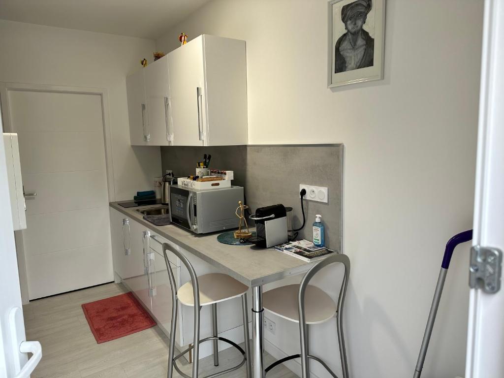 Kuchyňa alebo kuchynka v ubytovaní Saint dénis Appartement 1