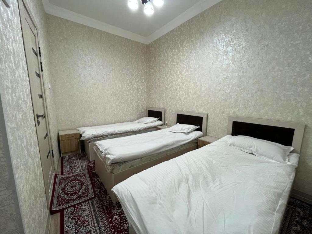 Postel nebo postele na pokoji v ubytování Bruce hostel
