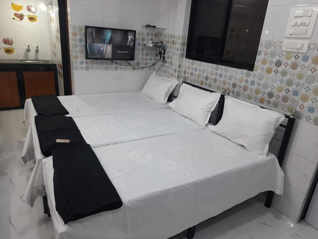 A1 HOME STAY tesisinde bir odada yatak veya yataklar