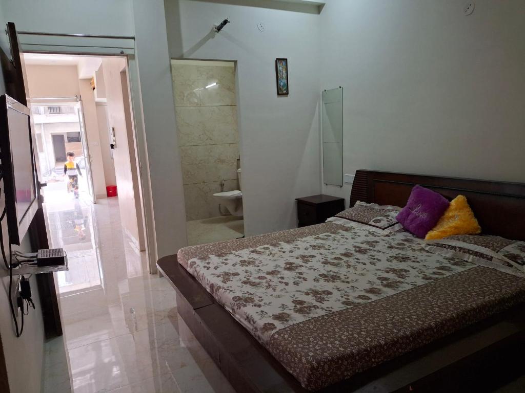 a bedroom with a bed and a walk in shower at 636 Kedia Kothhi in Jaipur