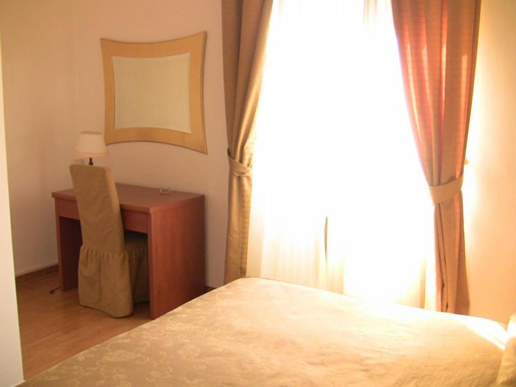 Postel nebo postele na pokoji v ubytování Hotel Picchio