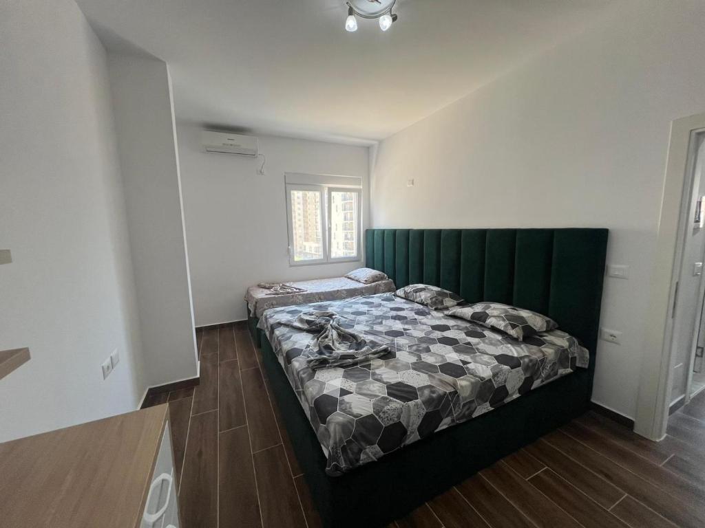 Voodi või voodid majutusasutuse Djonis Apartment toas
