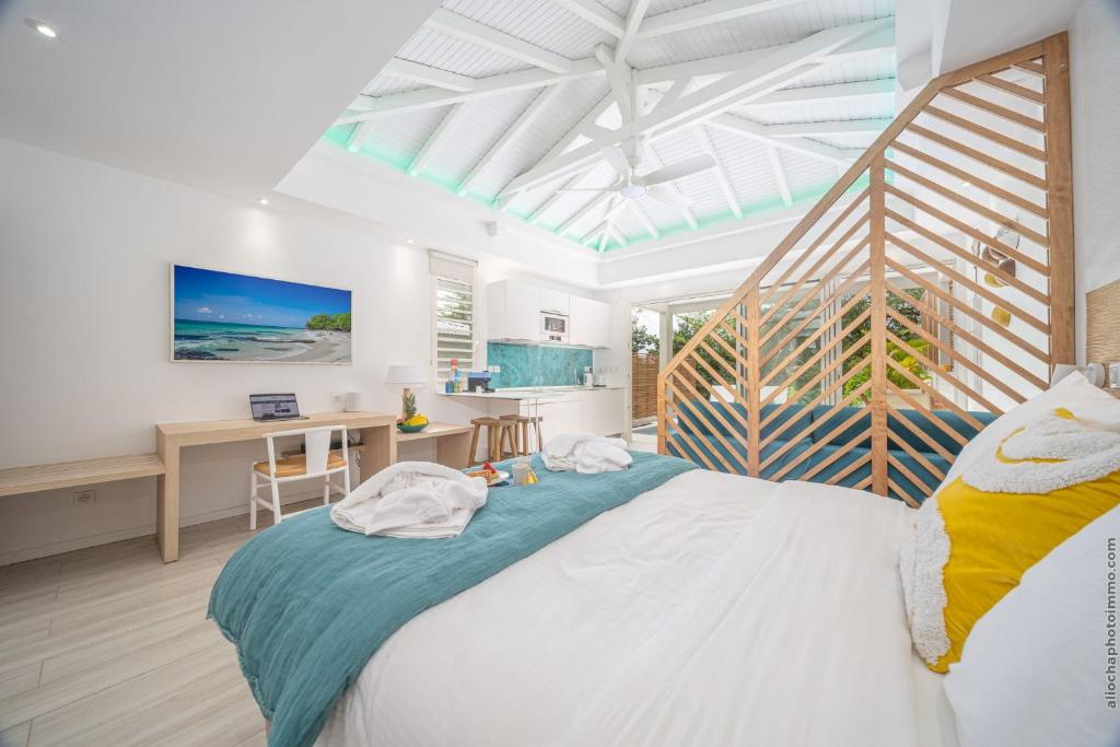 Postel nebo postele na pokoji v ubytování Cocoonhuts Résidences Martinique