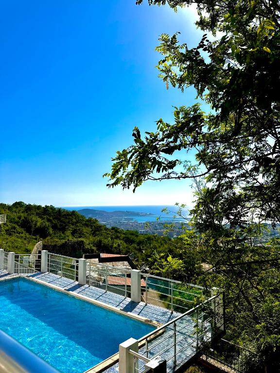 a villa with a swimming pool and a view of the ocean at Villa ELLA in Bar