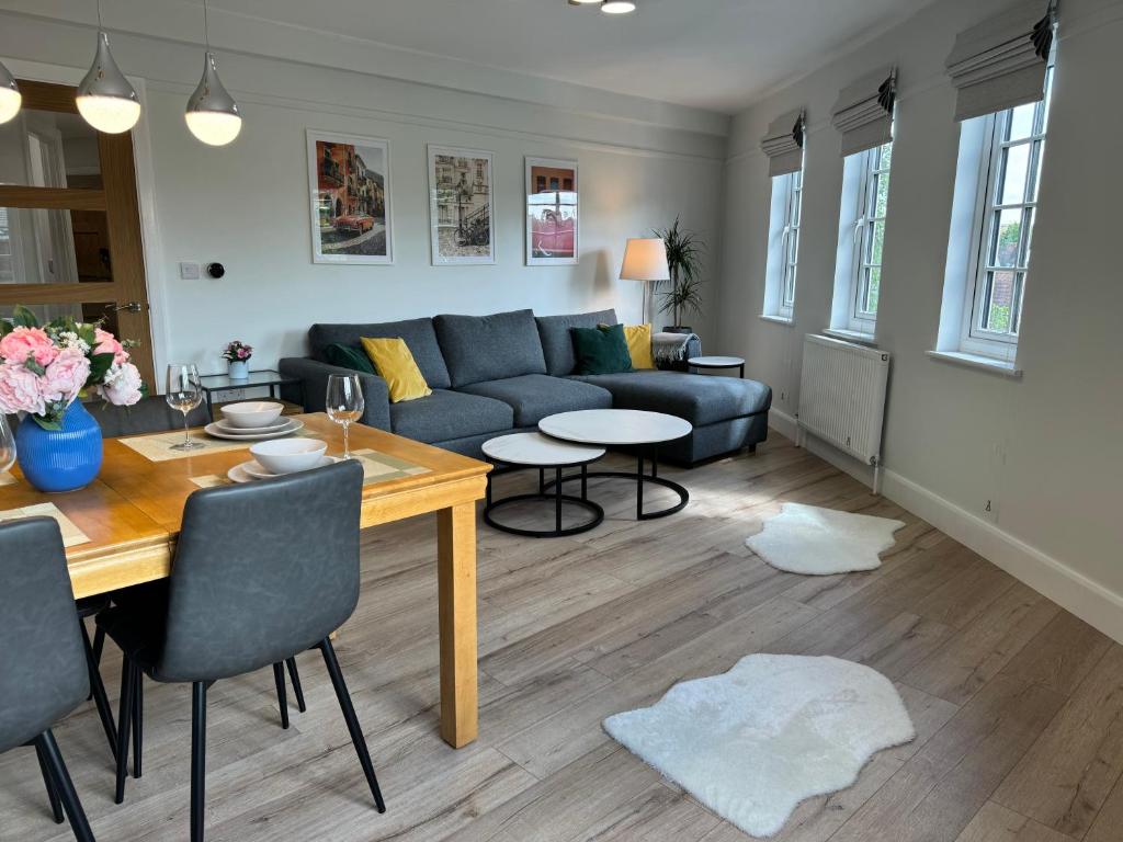 a living room with a couch and a table at Luxury Apartment in Letchworth in Letchworth