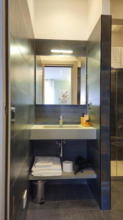 Koupelna v ubytování Real Rooms Dalia