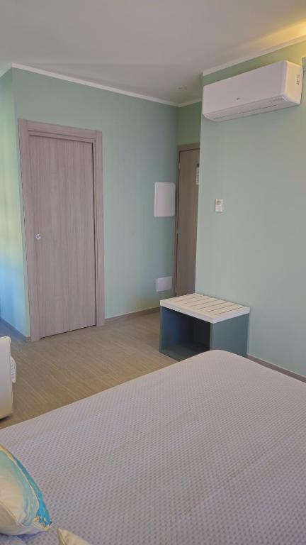 Postel nebo postele na pokoji v ubytování Real Rooms Dalia