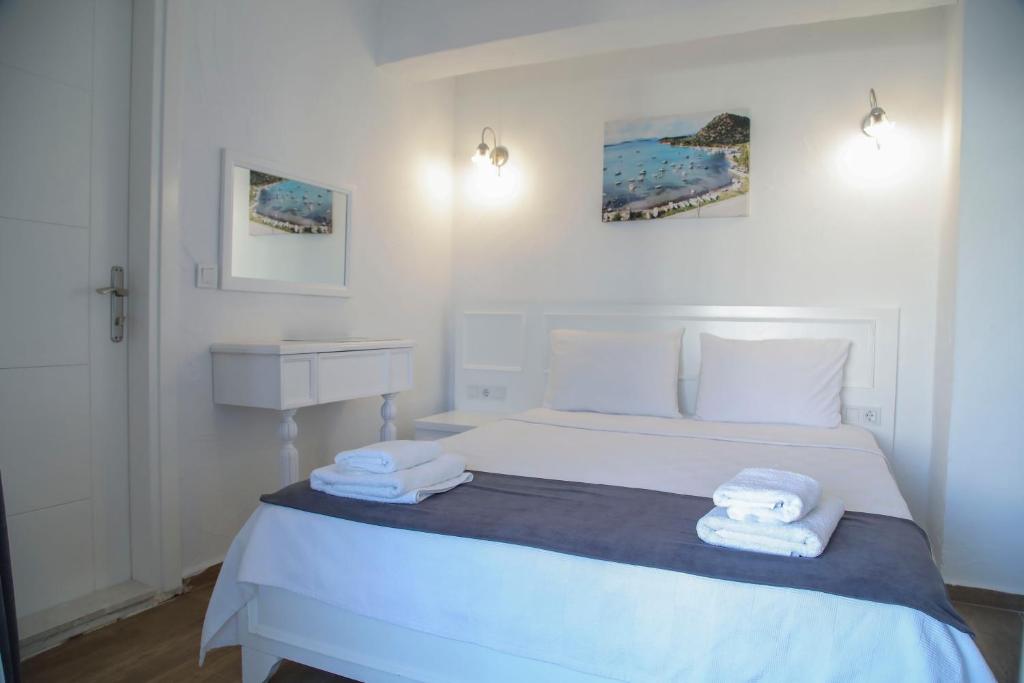 Postel nebo postele na pokoji v ubytování LONDİA OTEL