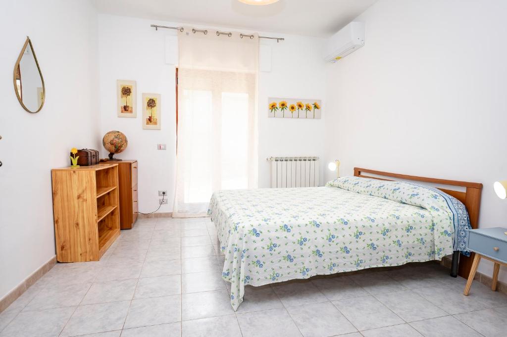 A bed or beds in a room at Casa Vacanze D'Urso