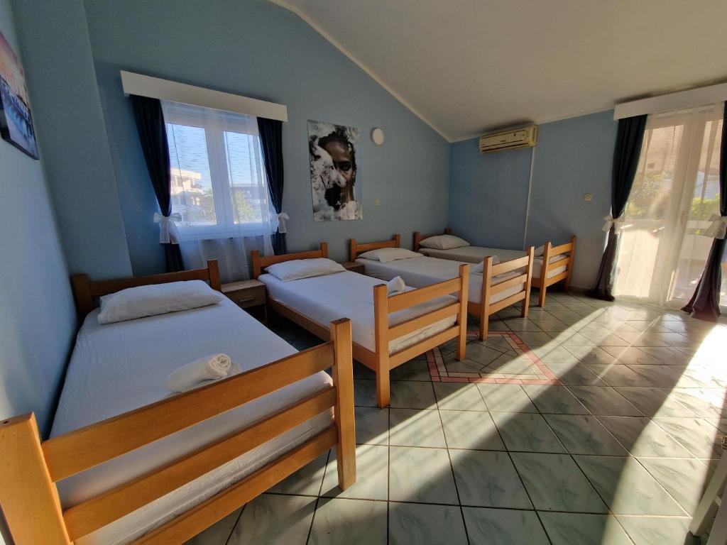 Postel nebo postele na pokoji v ubytování Pool Apartments Knežević