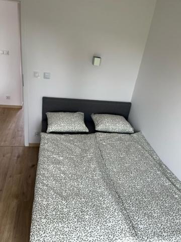 Posteľ alebo postele v izbe v ubytovaní Jula - apartamenty w Kudowie-Zdrój