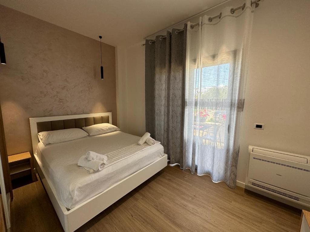Postel nebo postele na pokoji v ubytování Arial Trinity Suites