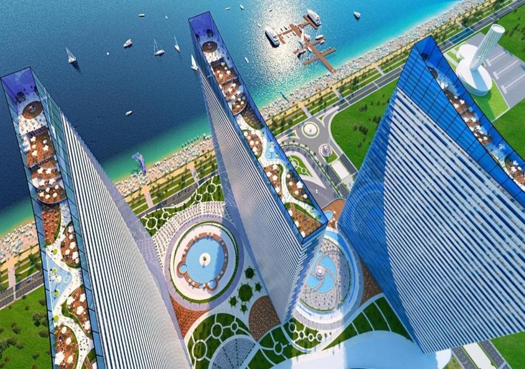an aerial view of a city with tall buildings at Orbi City Luxury Towers in Batumi