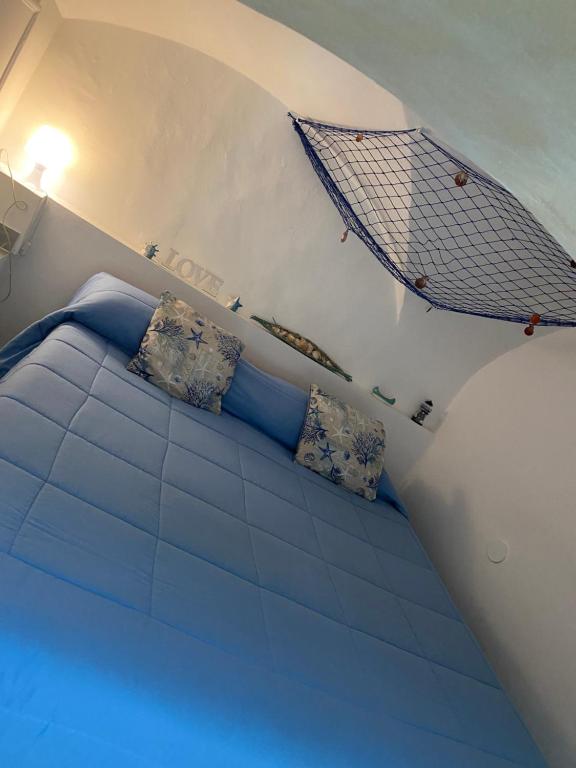 En eller flere senge i et værelse på Casa vacanza nina