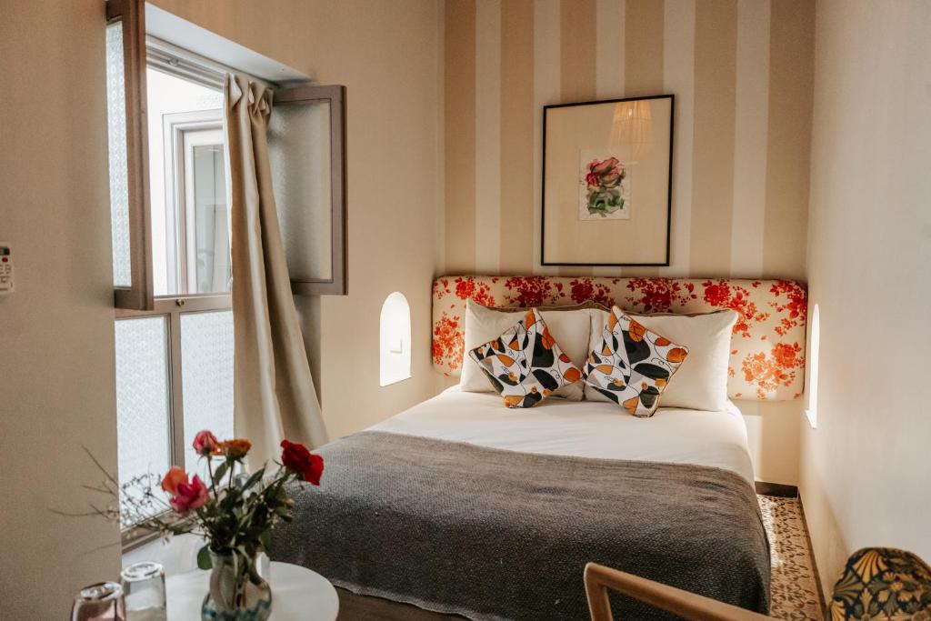 Postel nebo postele na pokoji v ubytování Riad Bab Ahmar