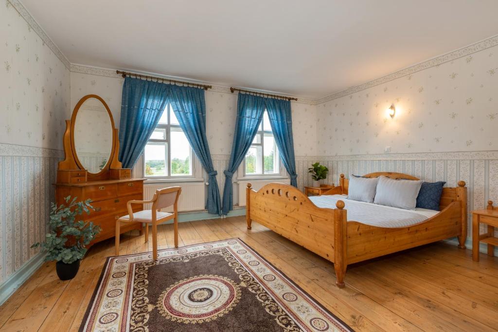 Postel nebo postele na pokoji v ubytování Kursi Summer Manor