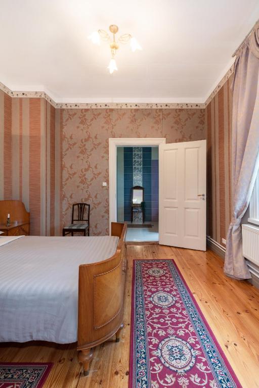 Postel nebo postele na pokoji v ubytování Kursi Summer Manor