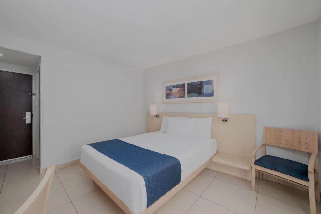 Postel nebo postele na pokoji v ubytování City Express by Marriott Minatitlán