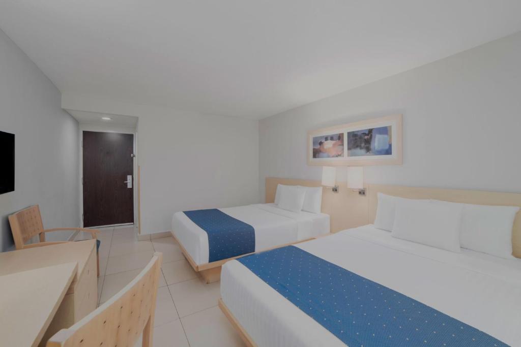 Postel nebo postele na pokoji v ubytování City Express by Marriott Minatitlán