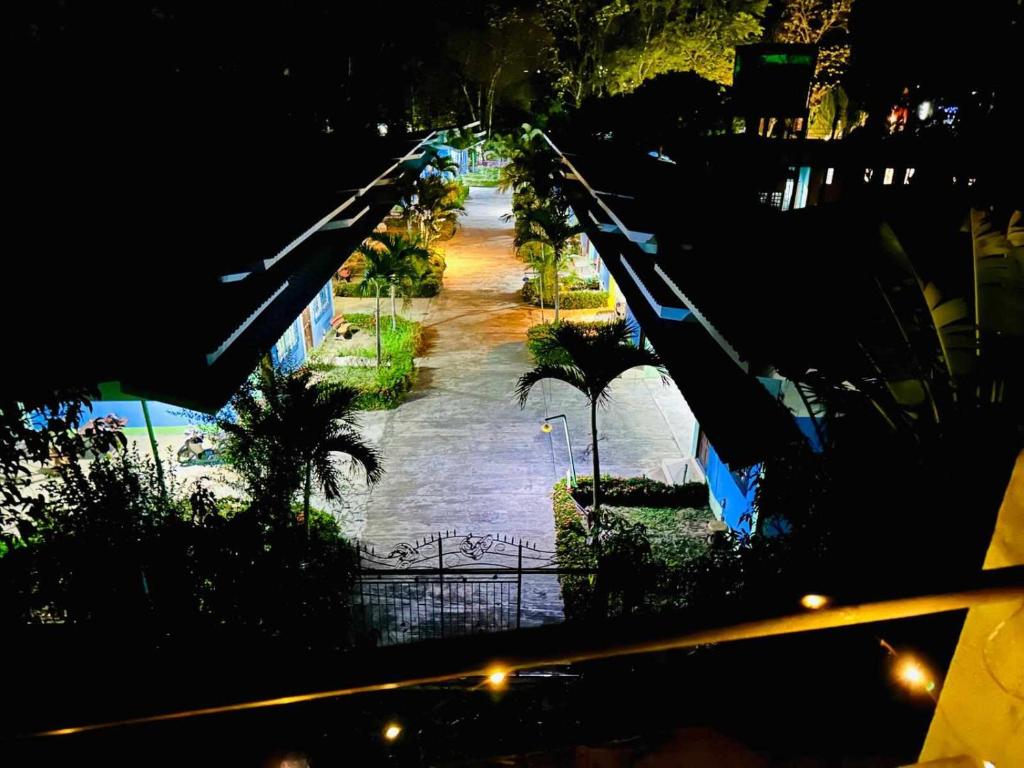 a park at night with a roller coaster at pran backpackermeetingplace hostel in Pai