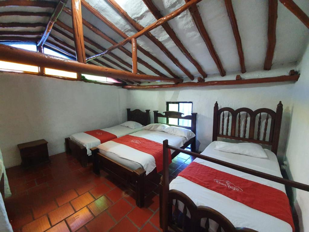 Cama o camas de una habitación en Hotel Casa Posada Don Chepe