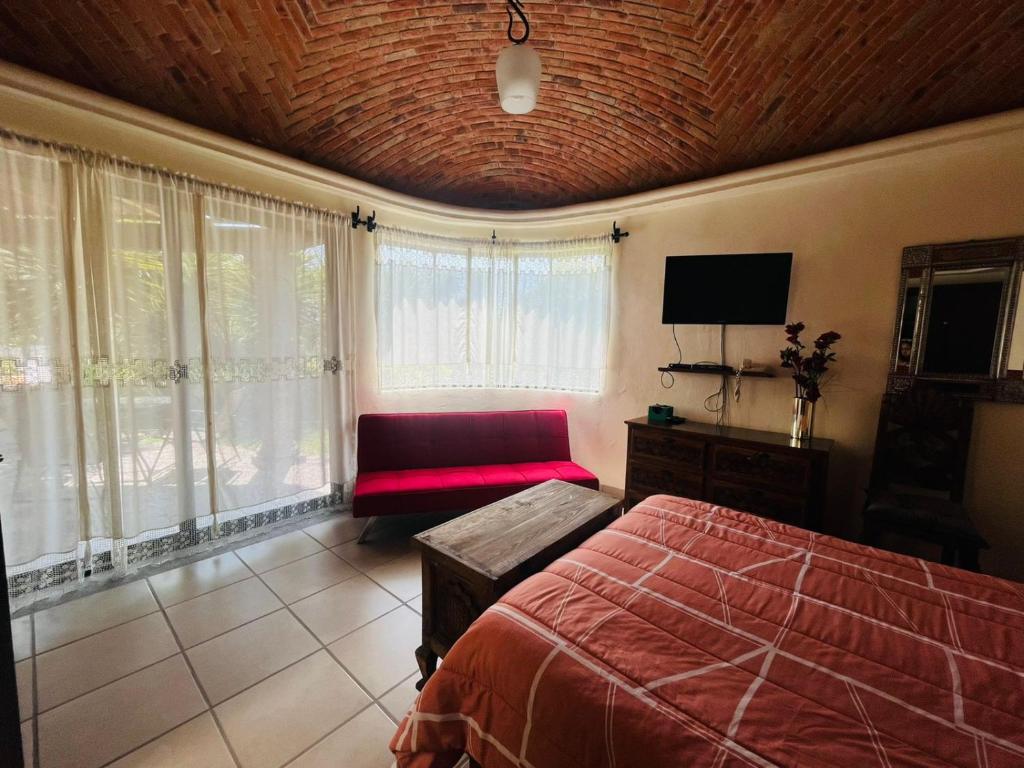 Postel nebo postele na pokoji v ubytování Rancho Labradores