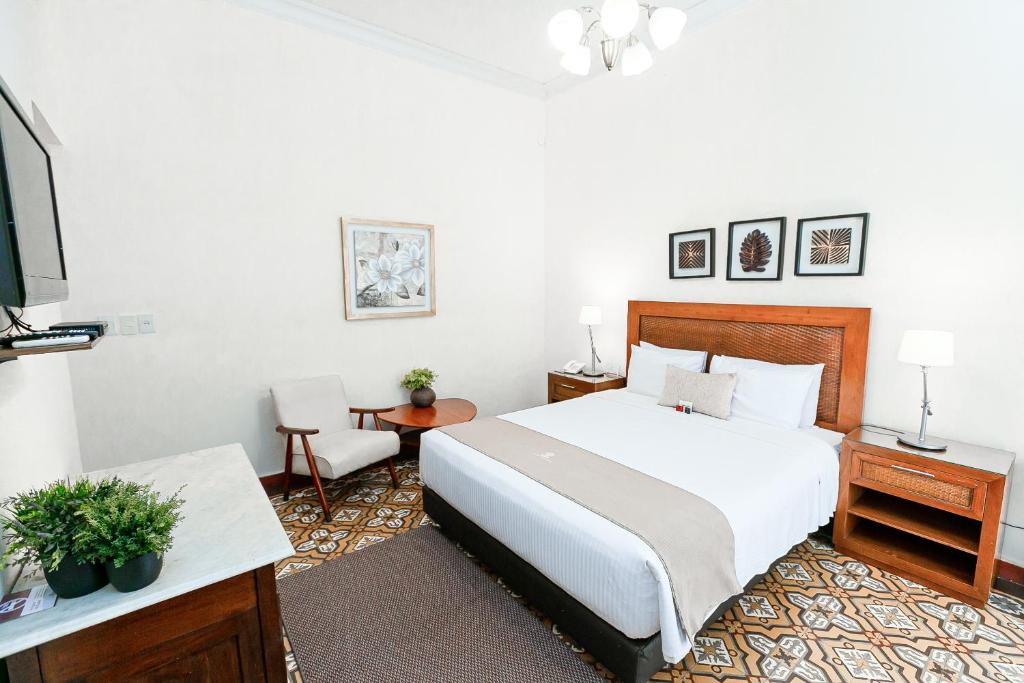 Postel nebo postele na pokoji v ubytování Gran Hotel del Paraguay