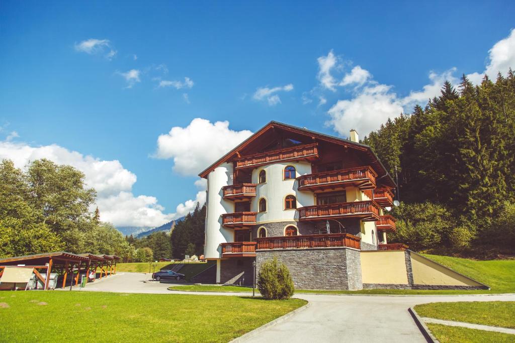 a building in the middle of a park at Apartmán Tále č.309 in Tale