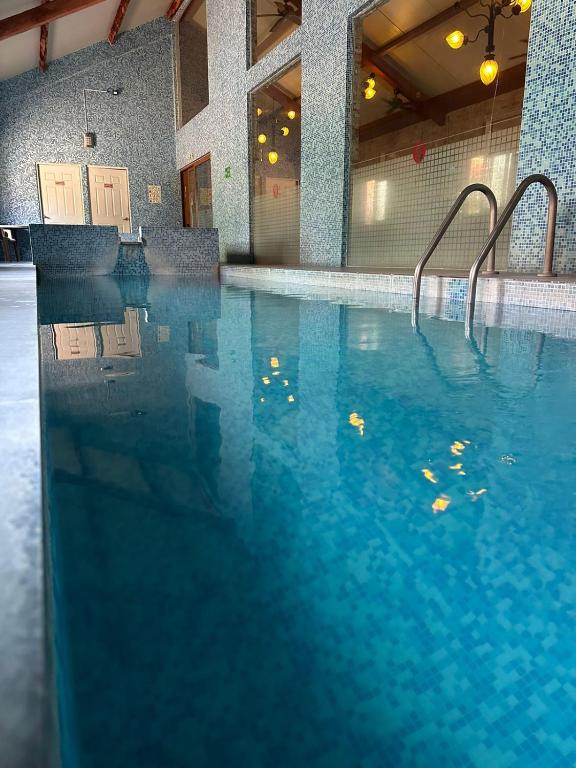 Bazén v ubytování Hotel Oliver Inn - Business Class nebo v jeho okolí