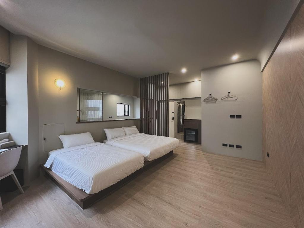 Postel nebo postele na pokoji v ubytování Yu Tainan BnB