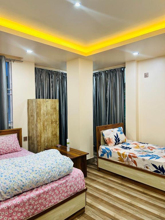 Postel nebo postele na pokoji v ubytování Hotel Balgopal