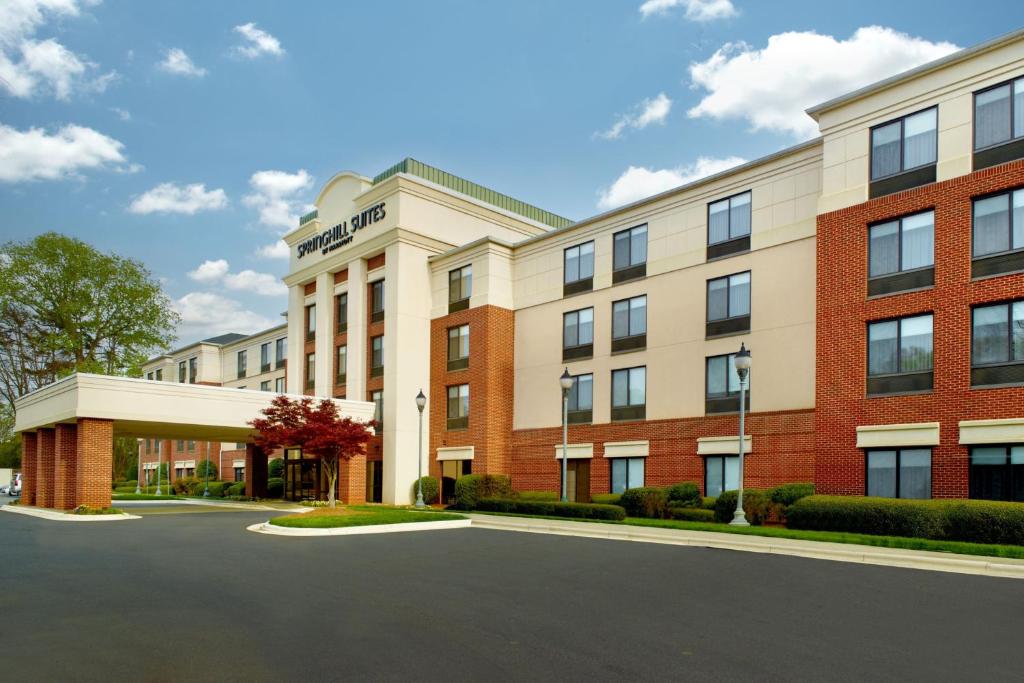 a rendering of the front of a hotel at SpringHill Suites Charlotte University Research Park in Charlotte