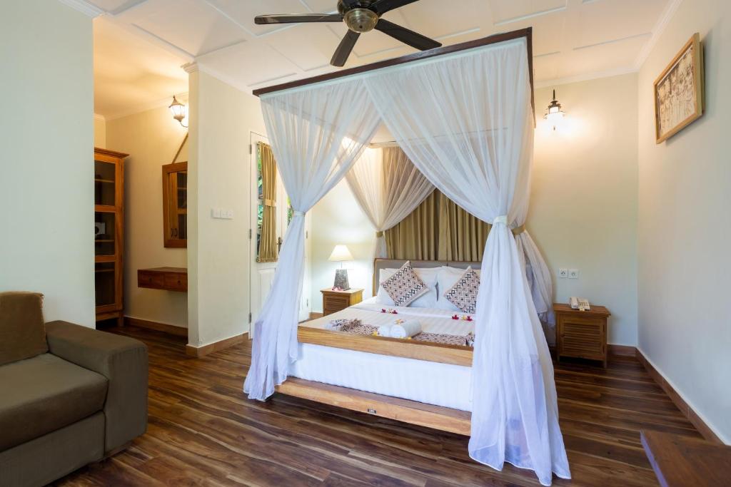 Postel nebo postele na pokoji v ubytování Abipraya Ubud