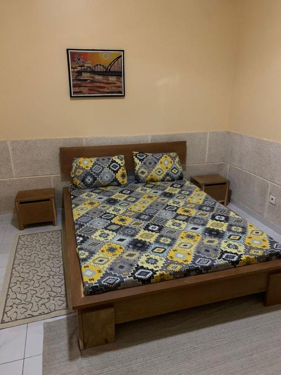 Ένα ή περισσότερα κρεβάτια σε δωμάτιο στο Chez Salimata