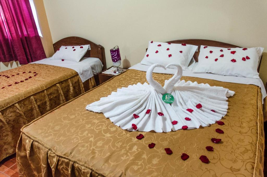 Postel nebo postele na pokoji v ubytování La Torre Inn