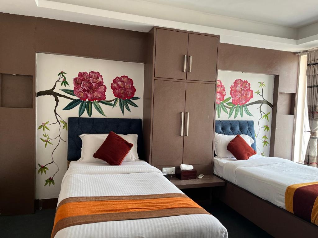 Postel nebo postele na pokoji v ubytování Hotel Kathmandu square