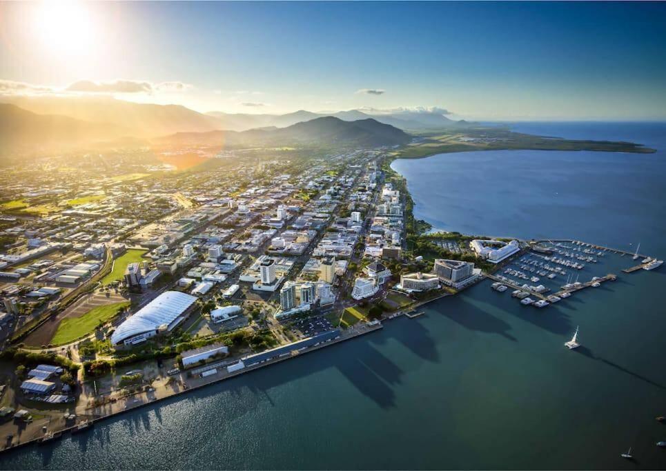 an aerial view of a harbor with boats in the water at Masterfully Restored Queenslander Near Esplanade in Cairns North