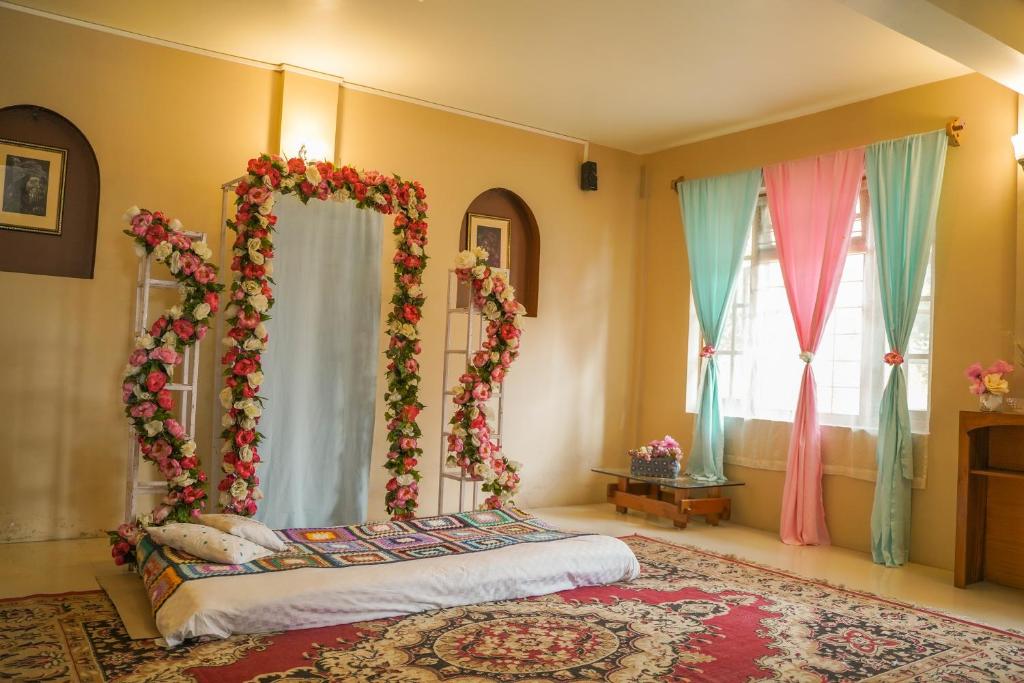 Postel nebo postele na pokoji v ubytování MISSION VALLEY Kalimpong