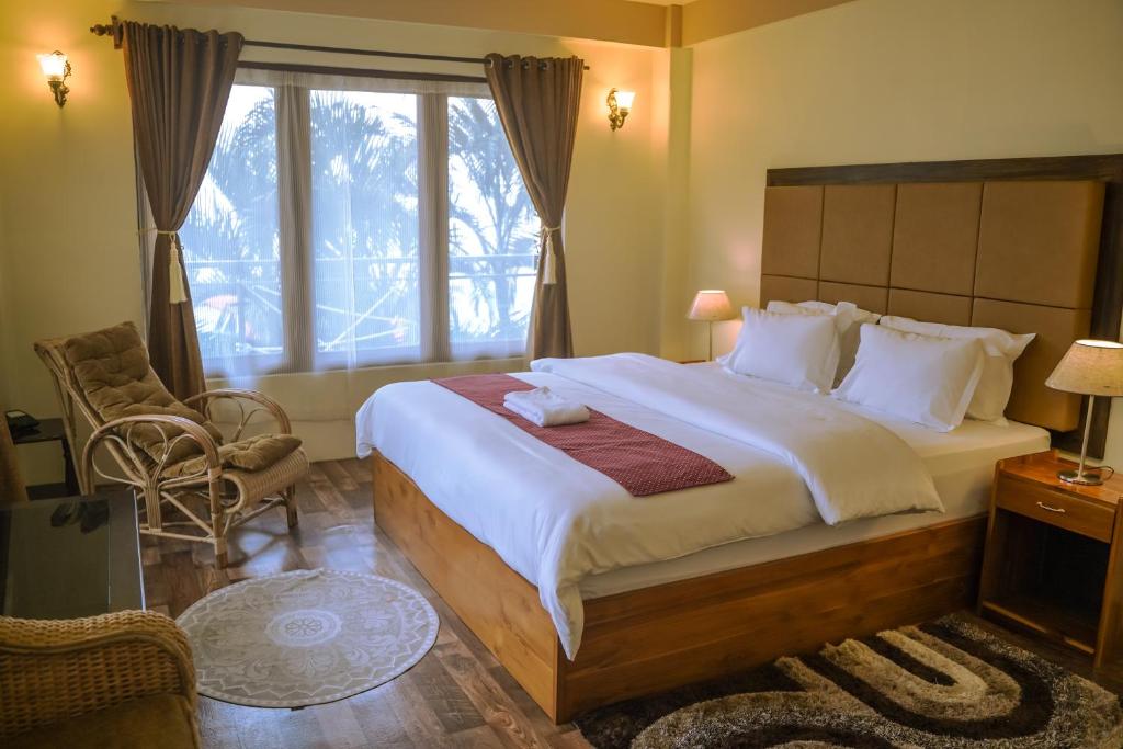 Postel nebo postele na pokoji v ubytování MISSION VALLEY Kalimpong