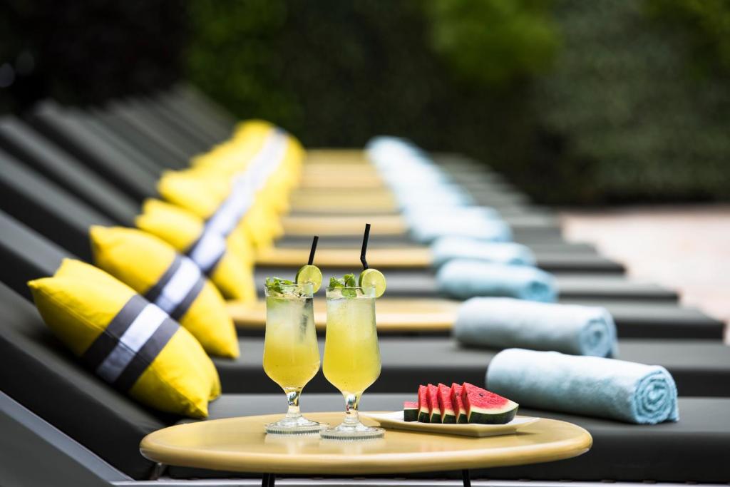 a table with two glasses of drinks on it at Viroth's Hotel in Siem Reap