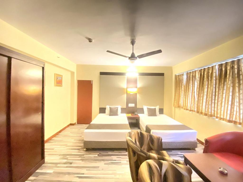 Postel nebo postele na pokoji v ubytování Astoria Hotel