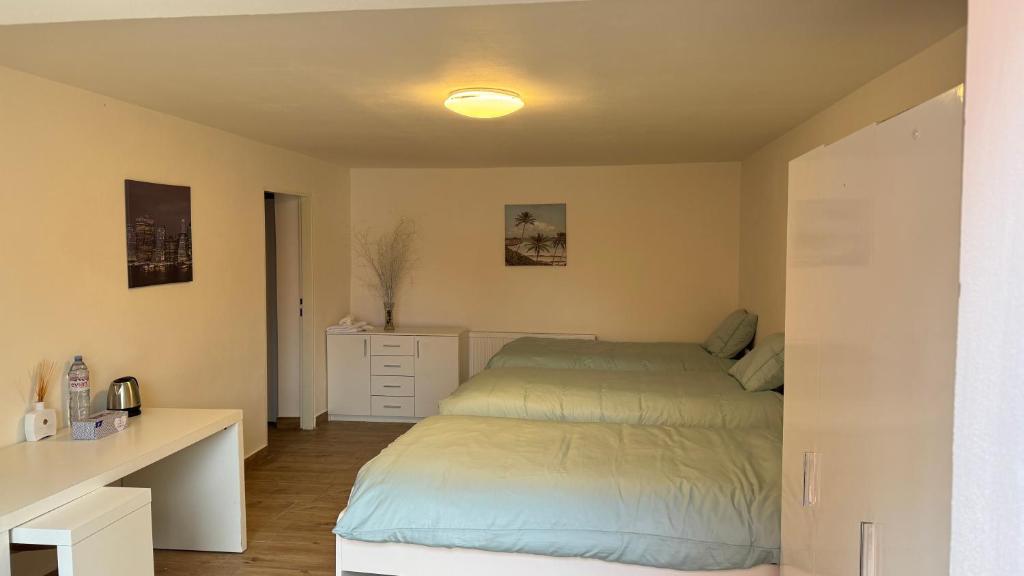 a small bedroom with a bed and a desk at 布拉格城堡公寓 in Rudná