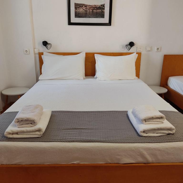 Postel nebo postele na pokoji v ubytování Anastasia Hotel
