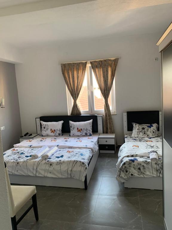 Postel nebo postele na pokoji v ubytování Hotel Albatros