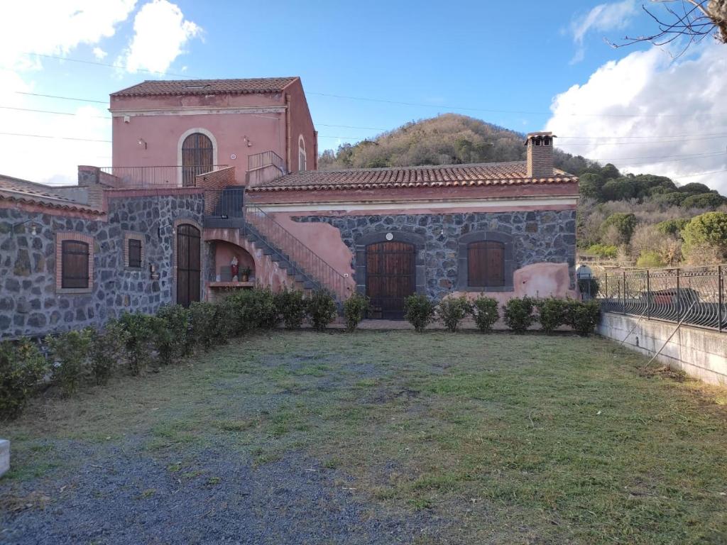 a large house with a yard in front of it at Case Gemmellaro - Family in Nicolosi