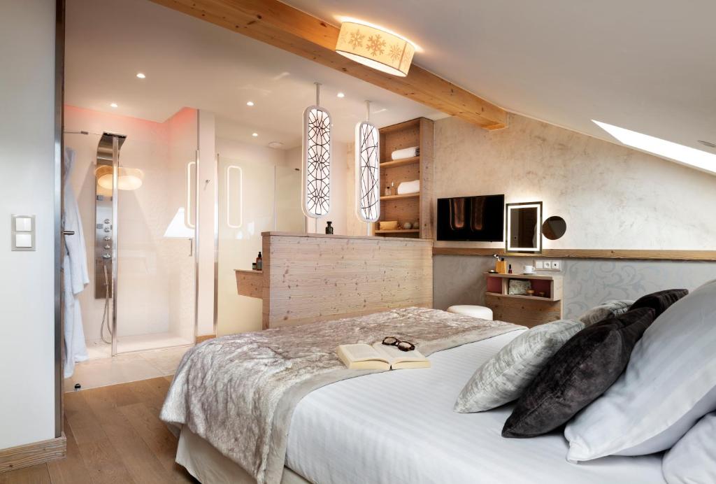 Кровать или кровати в номере Résidence Pierre & Vacances Premium L'Hévana